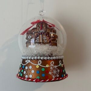 Festive Gingerbread Snow Globe Ornament